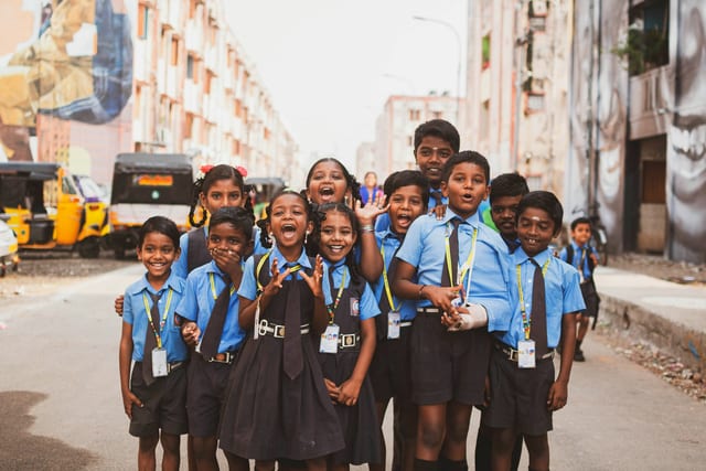 School pupils in uniform outside their school